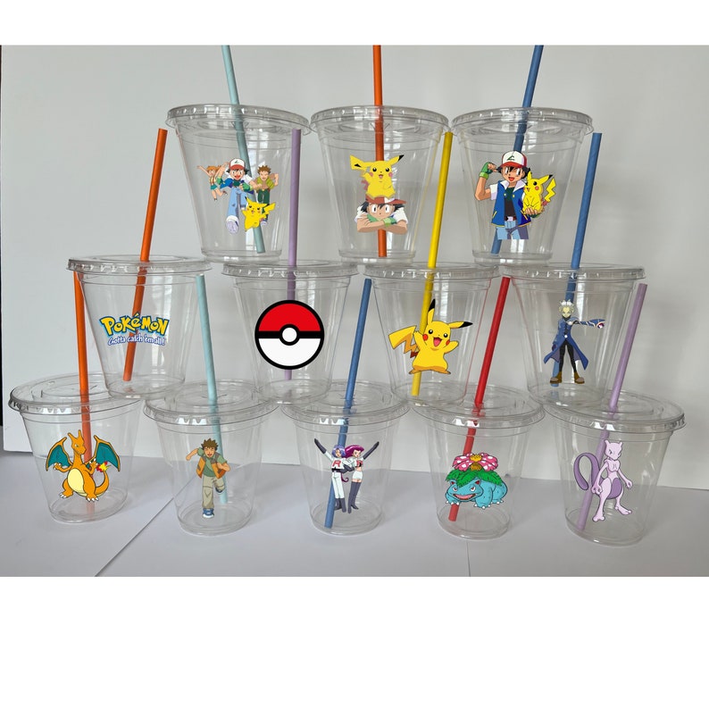 May include: Set of 12 clear plastic cups with colorful straws and Pokemon character stickers. The stickers feature various Pokemon characters, including Pikachu, Charizard, and Bulbasaur.