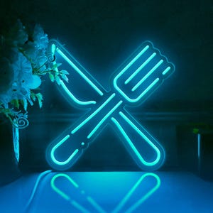 May include: A neon sign in the shape of a crossed fork and knife, glowing bright blue.