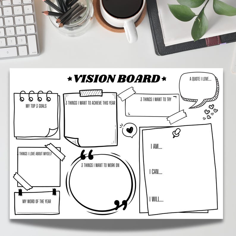 A printable black-and-white vision board template displayed on a desk with pencils, keyboard, notebook, coffee, and a plant. The layout includes sections for top goals, achievements, things to try, affirmations, quotes, self-love notes, and a word of the year to inspire personal growth and planning.