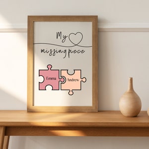 May include: A framed print with the text "My missing piece" and a heart symbol. Two jigsaw pieces are shown below the text, one labelled "Emma" and the other "Andrew".