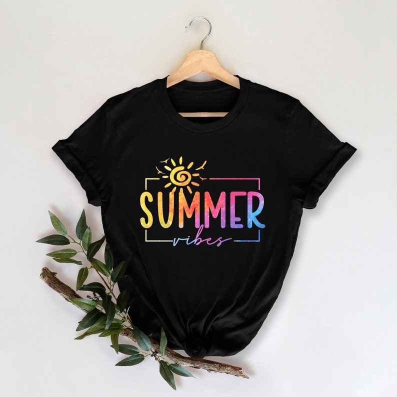 May include: Black t-shirt with a rainbow colored sun and the text "SUMMER vibes" in a white rectangle.