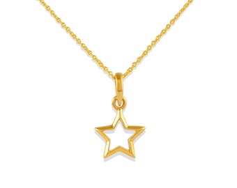 May include: A gold-colored necklace with a delicate chain and a star-shaped pendant. The pendant is a hollow star, showcasing a minimalist design. The necklace is displayed against a white background.
