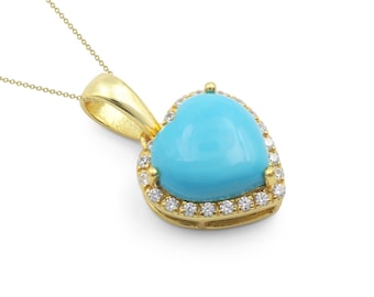 May include: A gold pendant necklace featuring a heart-shaped, light blue gemstone. The gemstone is surrounded by a halo of small, clear gemstones. The pendant hangs from a delicate gold chain, creating a classic jewelry piece.