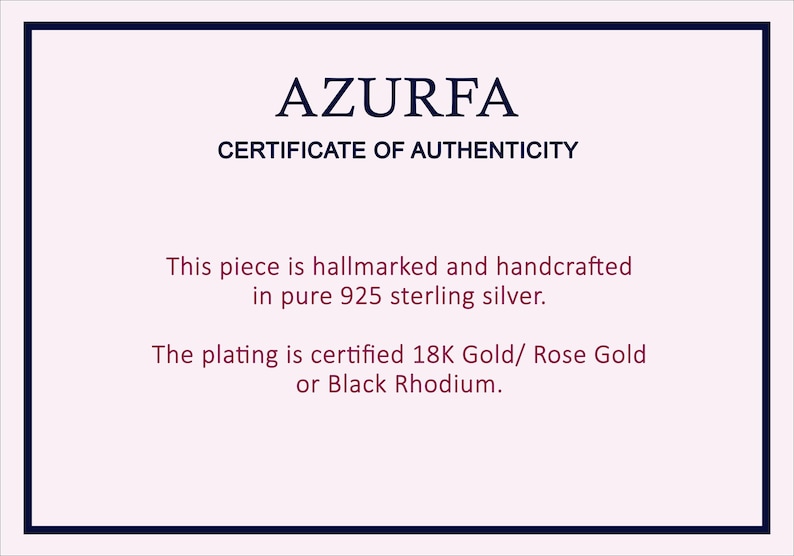 May include: A certificate of authenticity from AZURFA, with a navy blue border. The text states the piece is hallmarked and handcrafted in pure 925 sterling silver. The plating is certified 18K Gold, Rose Gold, or Black Rhodium.