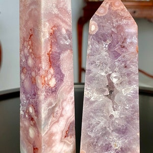 May include: Two amethyst crystal points, one with a pink and purple color and the other with a light purple color. The crystals are labeled A and B.