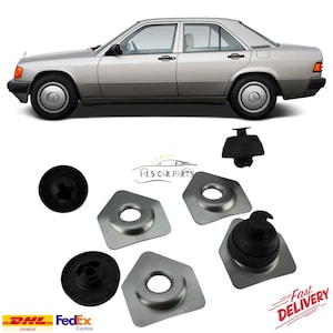 以下が含まれることがあります： 黒いタイヤとホイールキャップが付いたシルバーのセダン。画像には、黒いゴム製のグロメットや金属プレートなど、いくつかの自動車部品も表示されています。「HLS CAR PARTS」のロゴが表示されています。「Fast Delivery」の文字も表示されています。