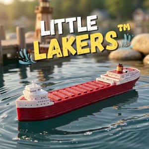 May include: A red and white toy freighter ship floats on water. The ship has a long cargo hold and a small tower. The words "LITTLE LAKERS" are in the image, with a water splash graphic.