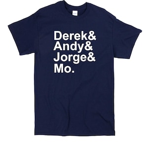 May include: A navy blue t-shirt with white text that reads "Derek & Andy & Jorge & Mo."