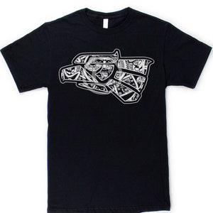 May include: Black t-shirt featuring a white graphic of a stylised eagle head. The eagle is made up of intricate patterns and designs.