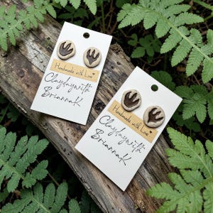 Dinosaur tracks footprints asymmetrical mismatched polymer clay stud earrings! (1 pair) | nature | gifts | handmade jewelry |
