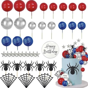 May include: A set of cake toppers featuring red, silver, and blue balloons, stars, spiders, and spiderwebs. The set also includes a round cake topper with the text "Happy Birthday".