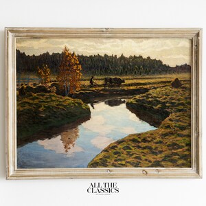 May include: A framed oil painting depicting a rural landscape with a winding river, a man walking with a cow, and a forest in the background. The painting is set in a light-colored frame.