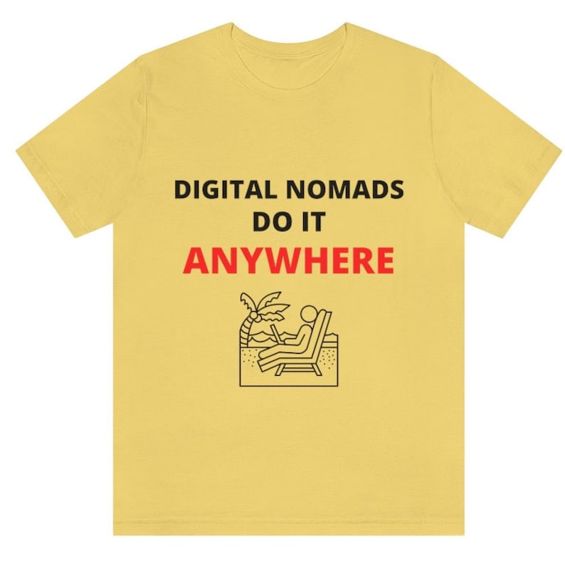 May include: Yellow t-shirt with black text that reads "DIGITAL NOMADS DO IT ANYWHERE". A black and white illustration of a person sitting in a beach chair with a laptop, palm tree, and sand.
