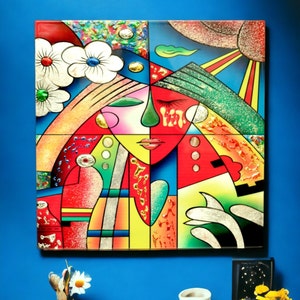 May include: Abstract art painting with a colorful, geometric design. The painting features a stylized face with closed eyes and a heart shape. The colors are bright and vibrant, including red, yellow, blue, green, and white.