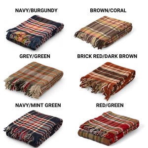 May include: Six plaid throw blankets in different color combinations. The blankets are folded and displayed on a white background. The color combinations are: Navy/Burgundy, Brown/Coral, Grey/Green, Brick Red/Dark Brown, Navy/Mint Green, and Red/Green.