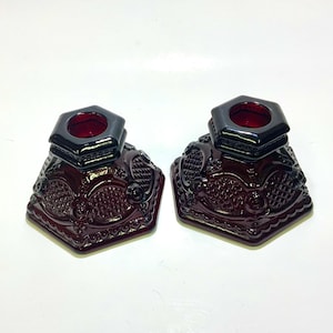 Avon Ruby Red Candlestick Holders.  Set of 2, 2 3/8” wide. Cape Cod 1876 Pattern Red Vintage Glassware.