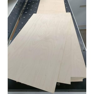 May include: Stack of three light wood veneer sheets, each with a natural wood grain pattern.