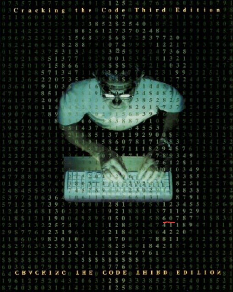 May include: A person wearing a blue shirt and glasses is typing on a keyboard. The background is a black and green grid of numbers. The text "Cracking the Code Third Edition" is at the top of the image.