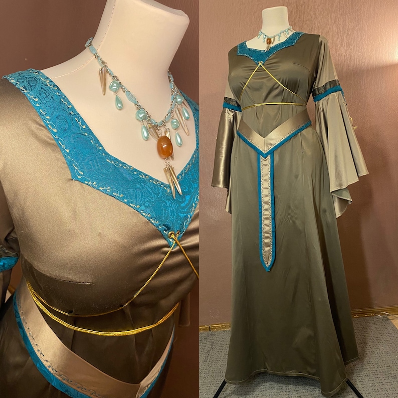May include: A long, flowing gown with a brown satin bodice and a teal blue trim. The gown has a gold sash and a matching necklace with teal blue and amber beads.