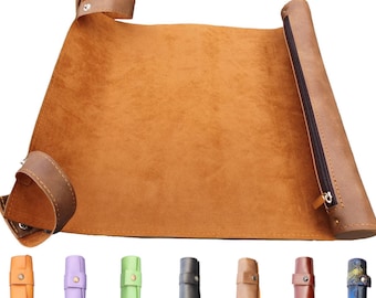May include: A brown leather roll-up tray with a zip closure and a selection of coloured roll-up sleeves. The tray is open, showing a soft, suede-like interior. The sleeves are in orange, lilac, green, black, tan, brown, and patterned blue.
