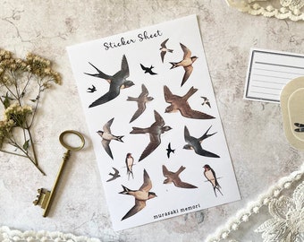 May include: A sticker sheet featuring illustrations of swallows in various poses. The birds are depicted in shades of brown, black, and gray, with the text "Sticker Sheet" at the top. The brand name "murasaki memori" is printed at the bottom.