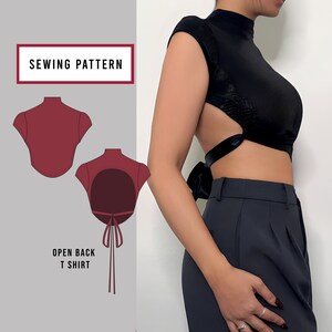May include: Sewing pattern for an open back t-shirt. The pattern is shown in red on a white background. The text "Sewing Pattern" is in a black box at the top of the image. The text "Open Back T Shirt" is below the pattern.