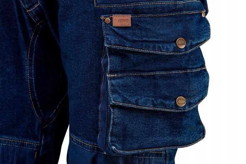 May include: Dark blue denim cargo pants with multiple pockets and brown button accents.