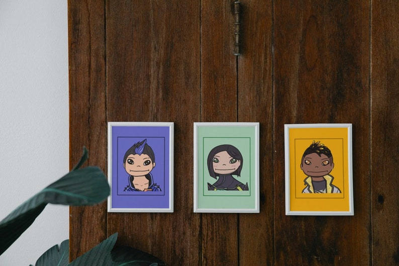May include: Three framed illustrations of cartoon characters. The first character has blue hair and is wearing a purple shirt. The second character has black hair and is wearing a green shirt. The third character has brown skin and is wearing a yellow shirt.