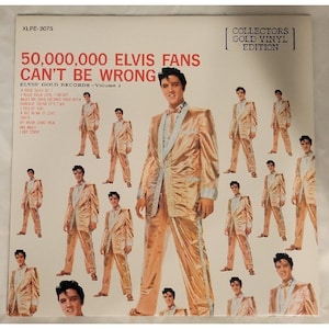 May include: A vintage vinyl record album cover featuring Elvis Presley in a gold suit. The album is titled "50,000,000 Elvis Fans Can't Be Wrong." The cover includes multiple images of Elvis and the text "Collectors Gold Vinyl Edition."