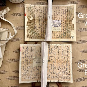 May include: Four pieces of old, yellowed paper with handwritten text in black ink. The paper is folded and has a worn, aged appearance. The text is difficult to read, but it appears to be in a foreign language. The paper is labeled "Green A" and "Green B".