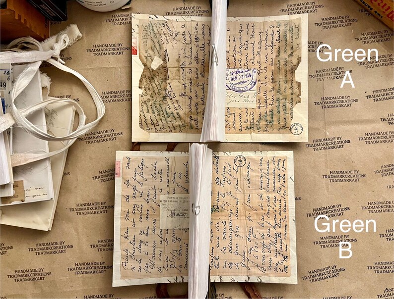 May include: Four pieces of old, yellowed paper with handwritten text in black ink. The paper is folded and has a worn, aged appearance. The text is difficult to read, but it appears to be in a foreign language. The paper is labeled "Green A" and "Green B".