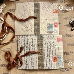May include: Two pieces of vintage paper with handwritten text and stamps. The paper is brown and has a worn look. There is a brown ribbon on top of the paper. The paper is labeled "Green A" and "Green B".