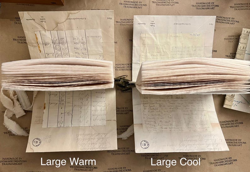 May include: Two stacks of vintage paper, one with a warm tone and the other with a cool tone. The paper is slightly yellowed and has a worn, aged look. The stacks are labeled "Large Warm" and "Large Cool".