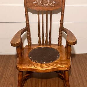 Antique rocker with leather seat deals
