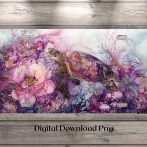 May include: A rectangular license plate featuring a sea turtle swimming through a vibrant underwater scene filled with large pink flowers, purple coral, and abstract watercolor textures. The design includes four mounting holes and the text DRD.
