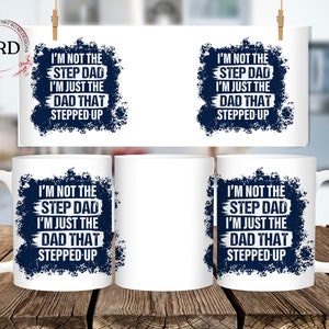 May include: White ceramic mug with a blue and white design. The text on the mug reads "I'm not the step dad I'm just the dad that stepped up".