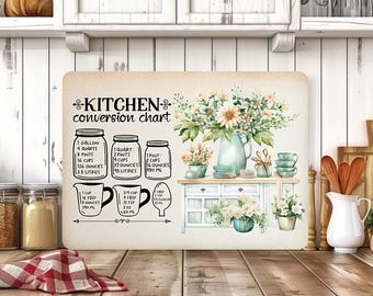 May include: A decorative kitchen conversion chart with floral accents. The chart includes measurements for gallons, quarts, pints, and cups. A watercolor illustration of a kitchen scene with flowers and a cabinet is also featured.