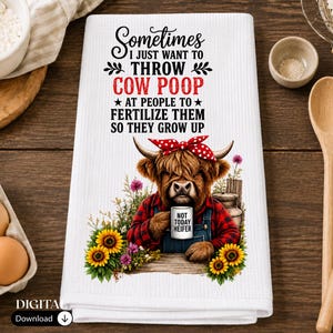 May include: A white waffle-weave kitchen towel featuring a graphic of a Highland cow wearing a red plaid shirt and a red polka-dot headband. The cow holds a mug labeled NOT TODAY HEIFER. Text reads: SOMETIMES I JUST WANT TO THROW COW POOP AT PEOPLE TO FERTILIZE THEM SO THEY GROW UP.