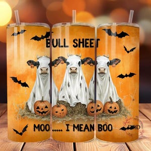 May include: Three stainless steel tumblers with a Halloween theme. The tumblers feature a white cow with black spots dressed as a ghost with the text "Bull Sheet Moo... I Mean Boo". The background is orange with black bats.