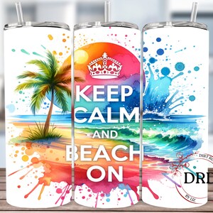 May include: A white tumbler with a watercolor design of a beach scene, palm tree, and ocean waves. The text "Keep Calm and Beach On" is printed in black on the tumbler.