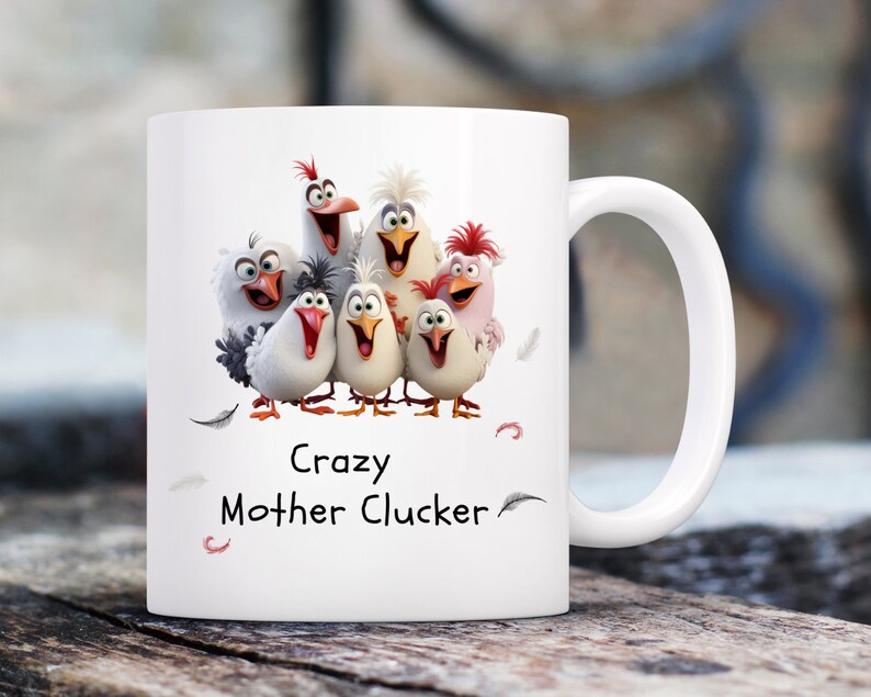 May include: White ceramic mug with a colorful cartoon image of a group of chickens. The text "Crazy Mother Cluckers" is printed on the mug.