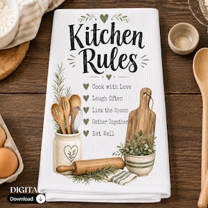 May include: A white waffle-weave kitchen towel featuring the text Kitchen Rules and a list of phrases including Cook with Love, Laugh Often, Lick the Spoon, Gather Together, and Eat Well, decorated with illustrations of wooden utensils and herbs.