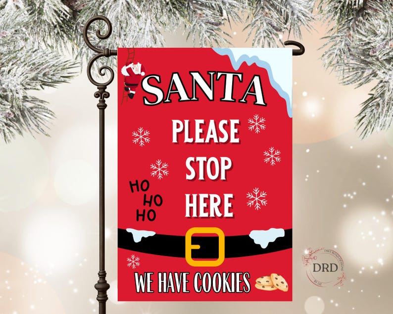 May include: A red Christmas garden flag with the words "SANTA PLEASE STOP HERE" in white. The flag features snowflakes, Santa Claus, and a belt design with the text "WE HAVE COOKIES".
