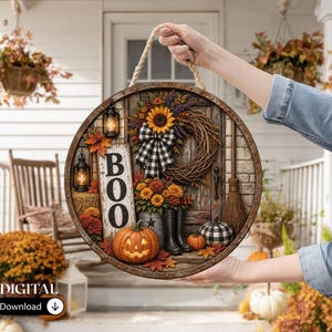 May include: A round decorative sign featuring a rustic door scene with a sunflower wreath, a black and white buffalo check bow, a sign reading BOO, a carved pumpkin, black rain boots, a broom, and lanterns, suspended by a thick rope.