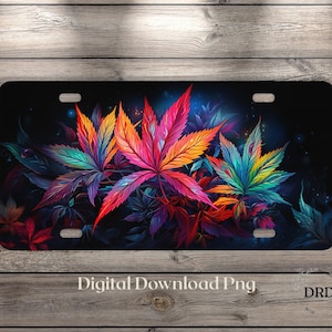 May include: A license plate featuring a vibrant, colorful cannabis leaf design. The leaves transition from red to orange, yellow, green, and blue against a dark background. Text at the bottom reads "Digital Download Png".