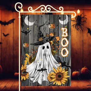 May include: A Halloween garden flag featuring a ghost wearing a witch hat, surrounded by sunflowers, bats, and pumpkins. The word "BOO" is displayed in orange letters. The background is a wooden plank design.
