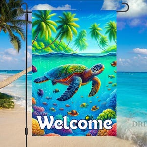 May include: A colorful garden flag featuring a vibrant underwater scene with a sea turtle, fish, and coral reef. The word "Welcome" is displayed in large white letters. Palm trees and a beach scene are in the background.