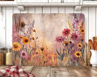 May include: Rectangular cutting board featuring a watercolor floral design. The artwork showcases vibrant yellow, pink, and purple flowers against a soft, textured background. The board is a kitchen accessory.
