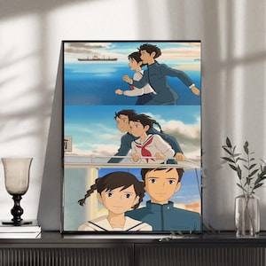 May include: Framed anime art print featuring three panels of a couple in a seaside setting. The artwork depicts a boy and girl in various poses, with a ship in the background and a blue sky.