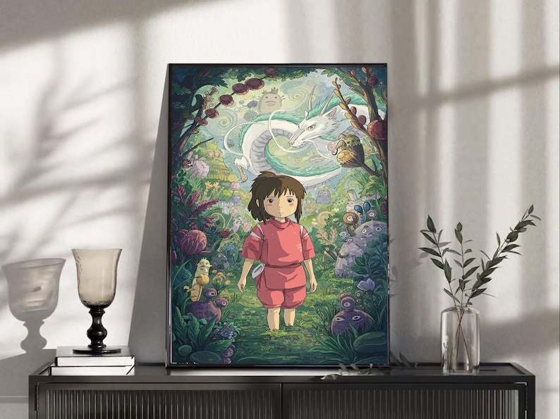 May include: Framed art print featuring a young girl in a pink outfit standing in a lush, colorful forest. A white dragon and other fantastical creatures are visible in the background. The artwork has a whimsical, animated style.